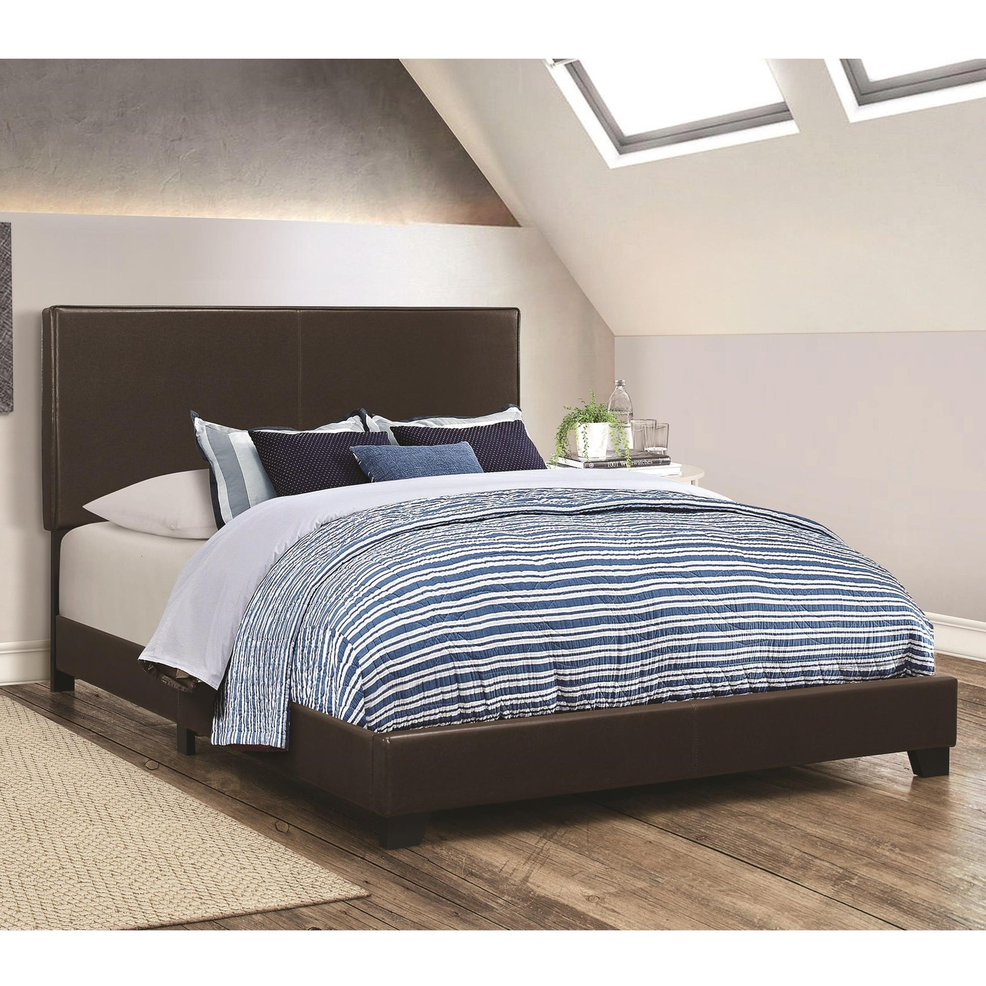 Leather upholstered Eastern King-Size platform bed in brown with a tall headboard.
