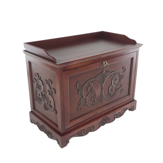 Engraved wooden shoe cabinet, brown finish with drop-down opening and metal hinges, ornate carved front.