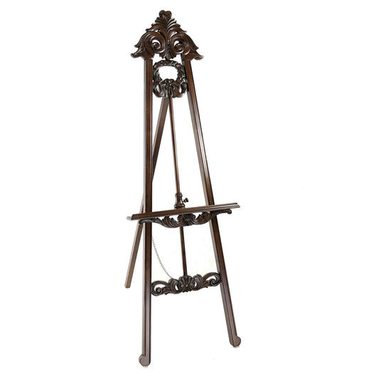 Traditional style wooden easel with ornate carved top and angular legs, brown finish.