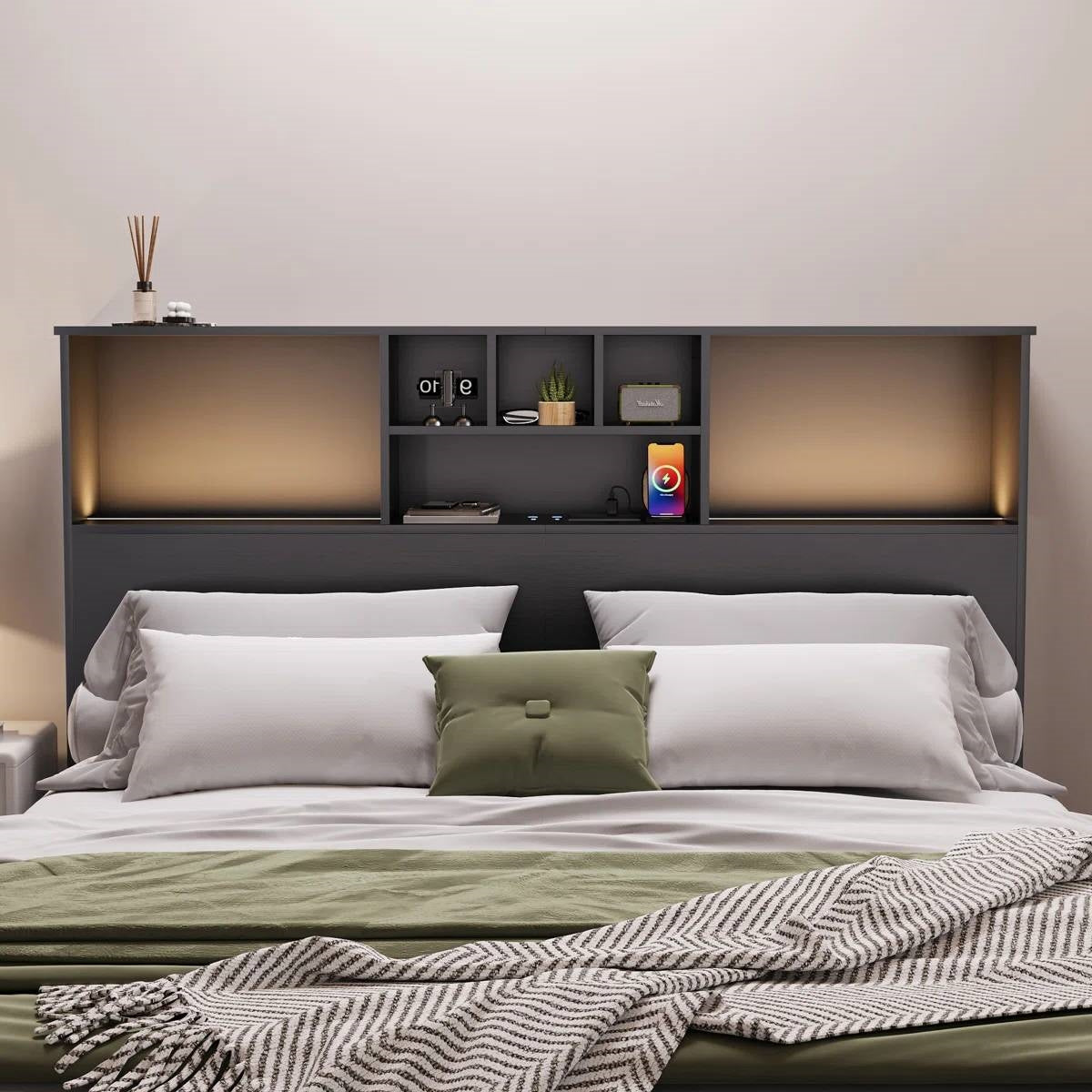 Queen size bed with a black wood finish bookcase headboard and built-in LED lighting