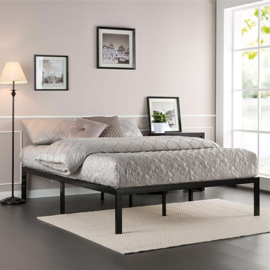 Twin size black metal platform bed frame with wood slats by FastFurnishings in a modern bedroom.
