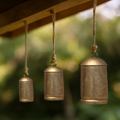 Zaira Decorative Iron Cow Bells Set of 3 | Cylindrical | Antique Gold Finish| Jute Hanging Rope | 20, 15, 12 Inches