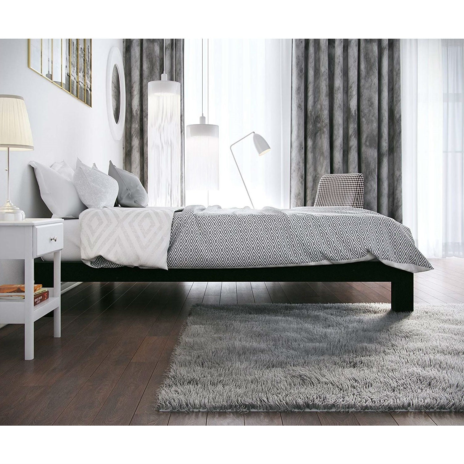 Full modern black metal platform bed frame with wood slats in a white-gray bedroom.