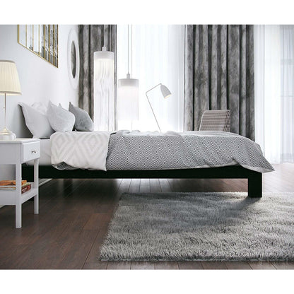 Full modern black metal platform bed frame with wood slats in a white-gray bedroom.