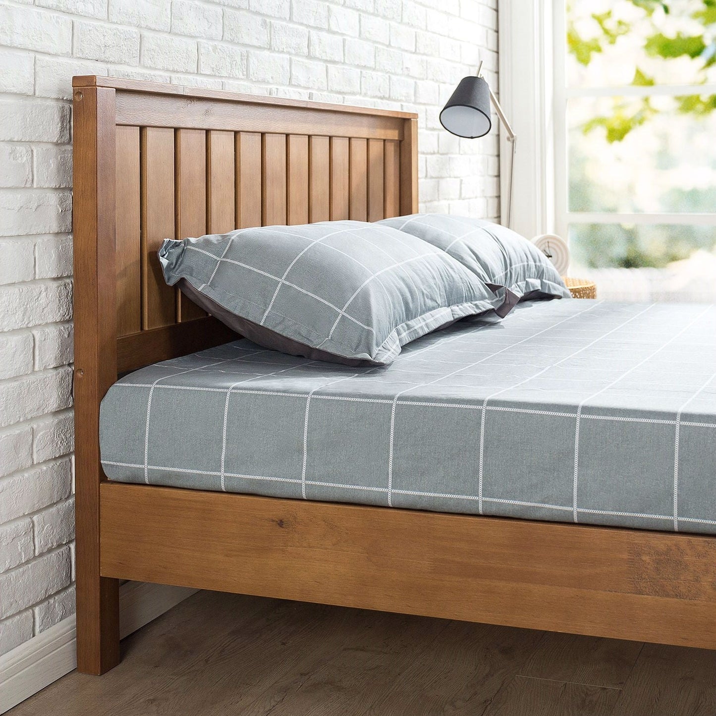 Twin solid wood platform bed frame with a medium brown finish and slatted headboard