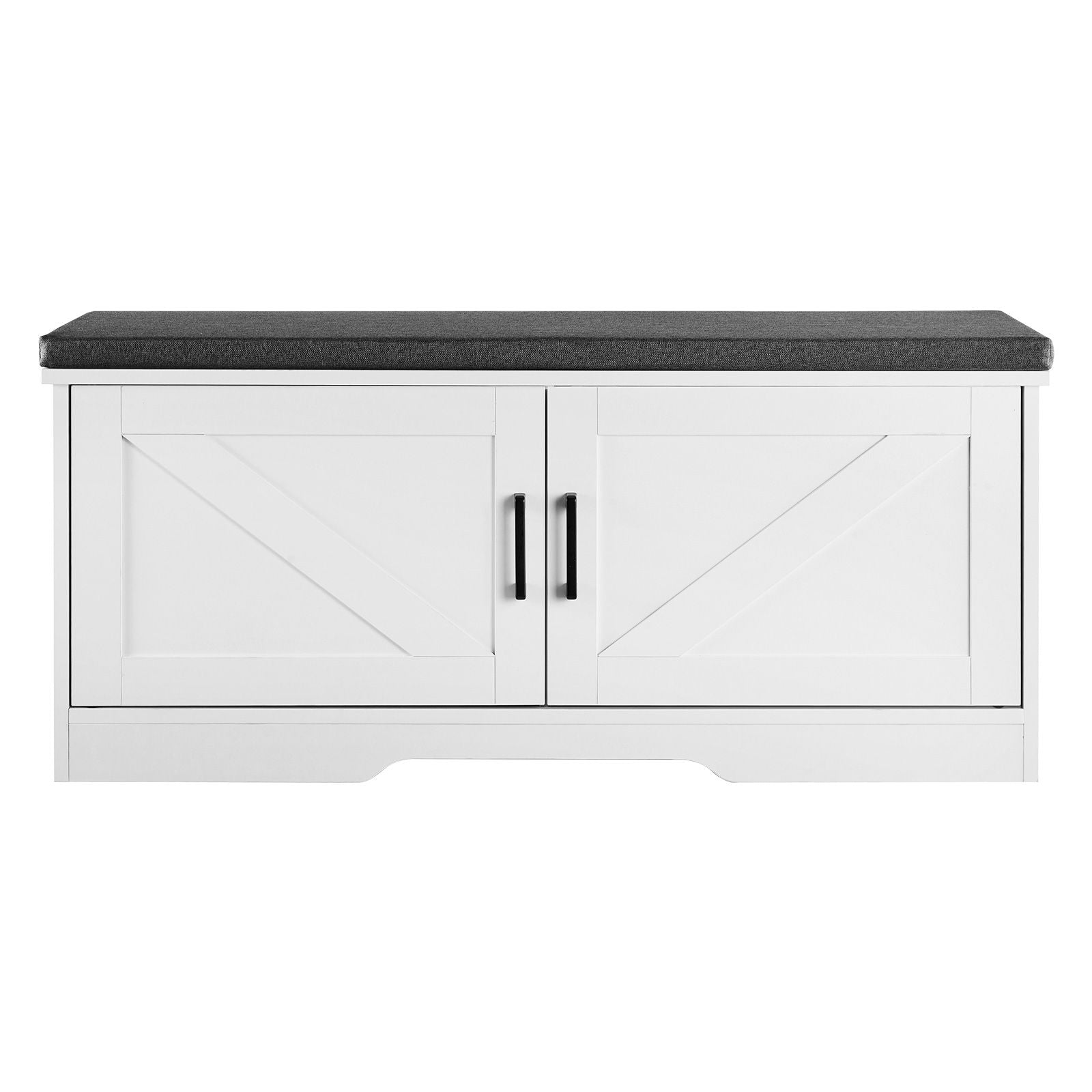 Shoe storage bench with dark gray cushioned top on a white double-door cabinet with black handles.