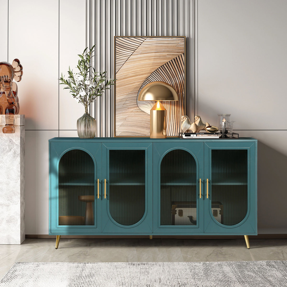 Teal TV stand with glass panel doors and gold handles.