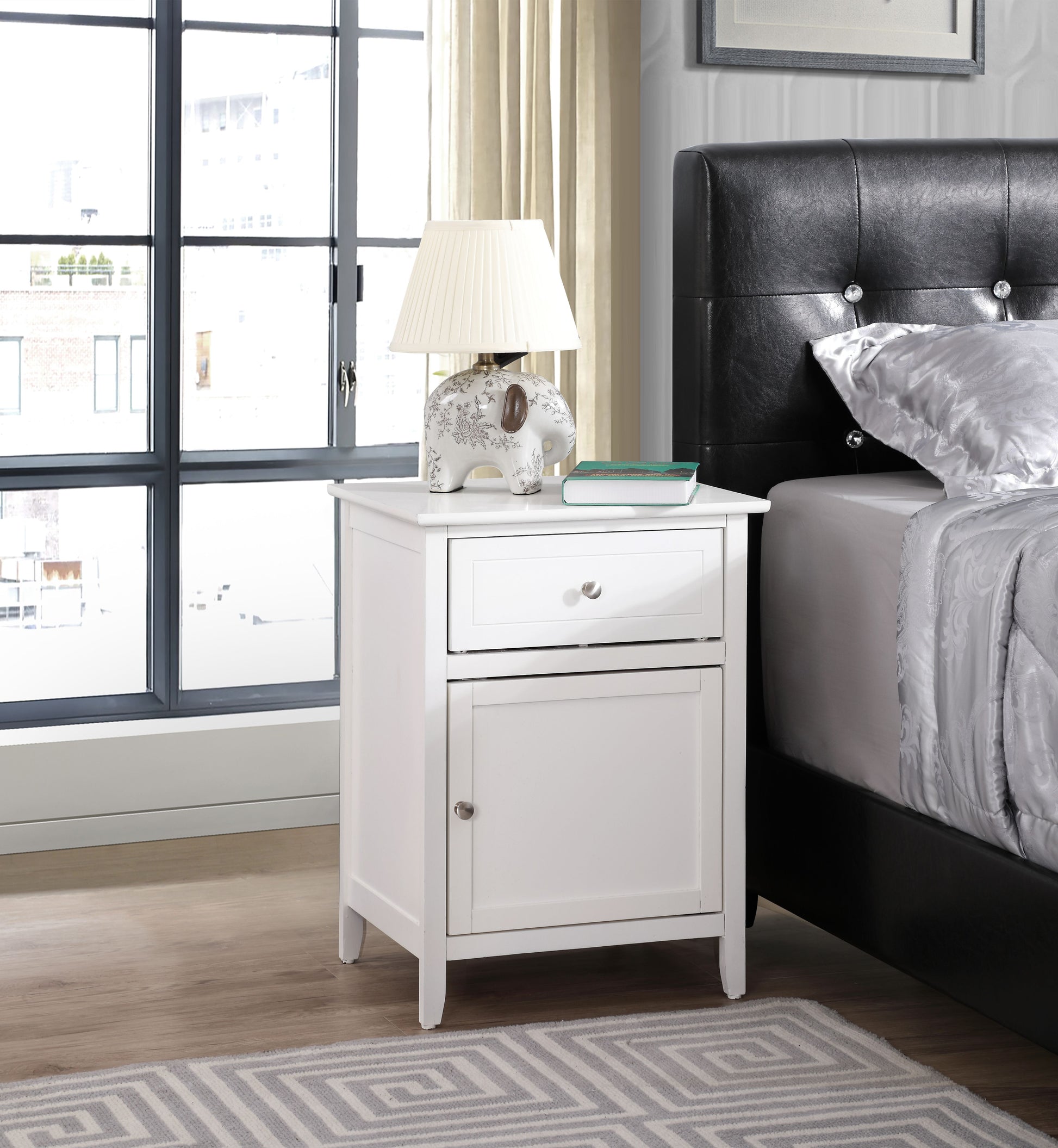 Elegant white nightstand with two drawers and a ceramic elephant lamp on top.