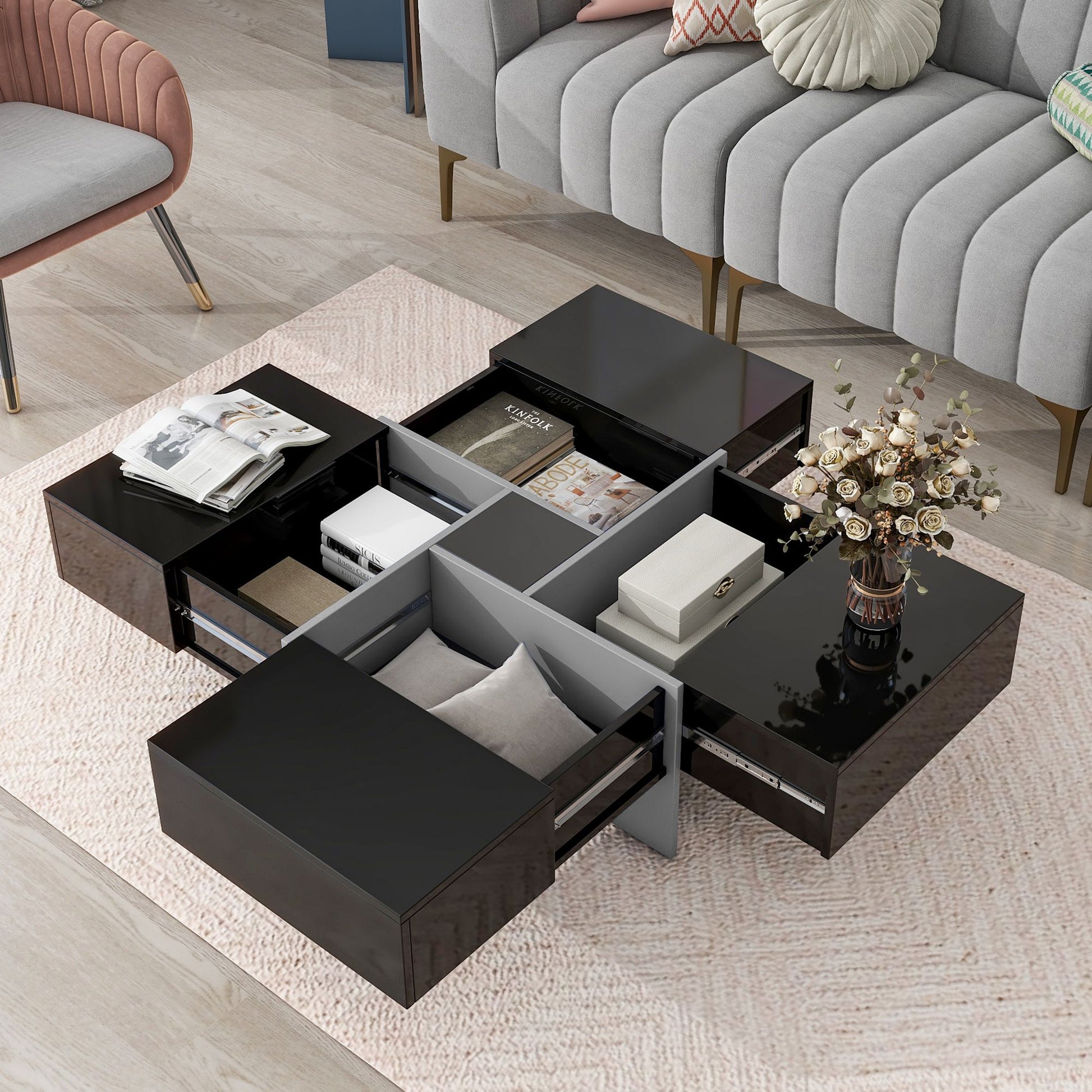 ON-TREND black coffee table with four hidden storage compartments and open drawers in a modern living room