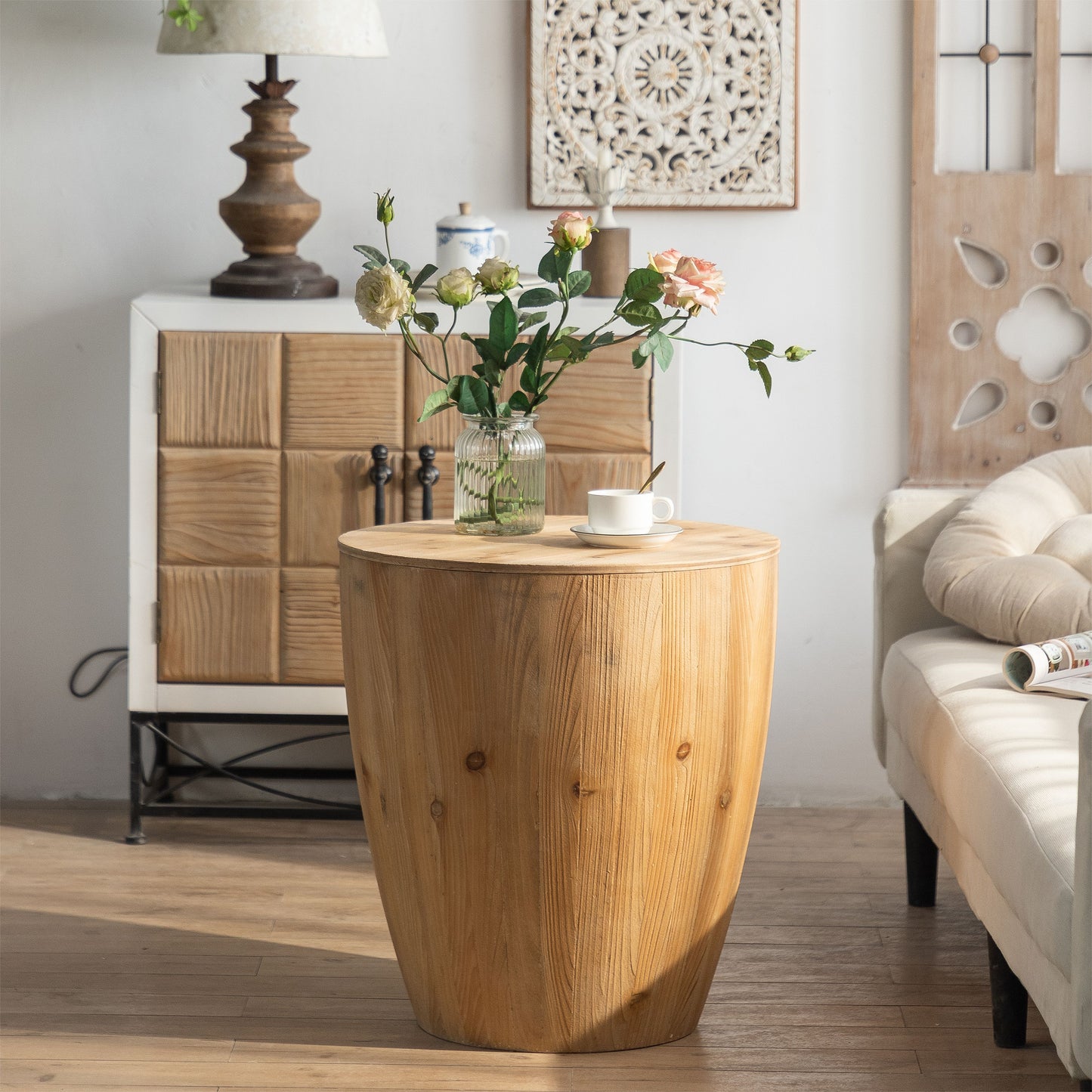 21.06-inch vintage style bucket-shaped coffee table in natural wood finish with roses in a vase in a living room.
