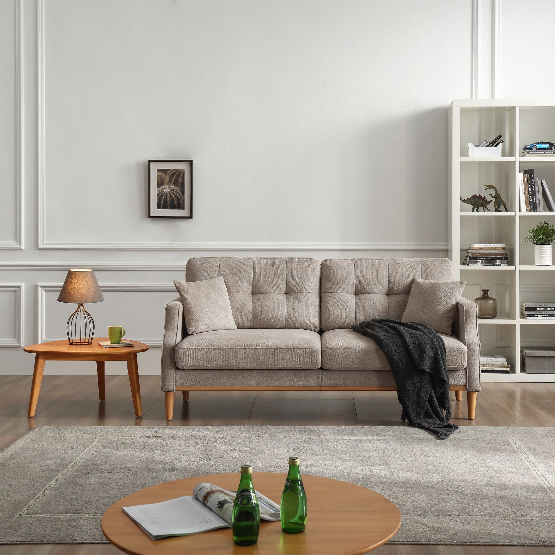 Living Space 3-seat sofa with gray fabric upholstery and wooden legs