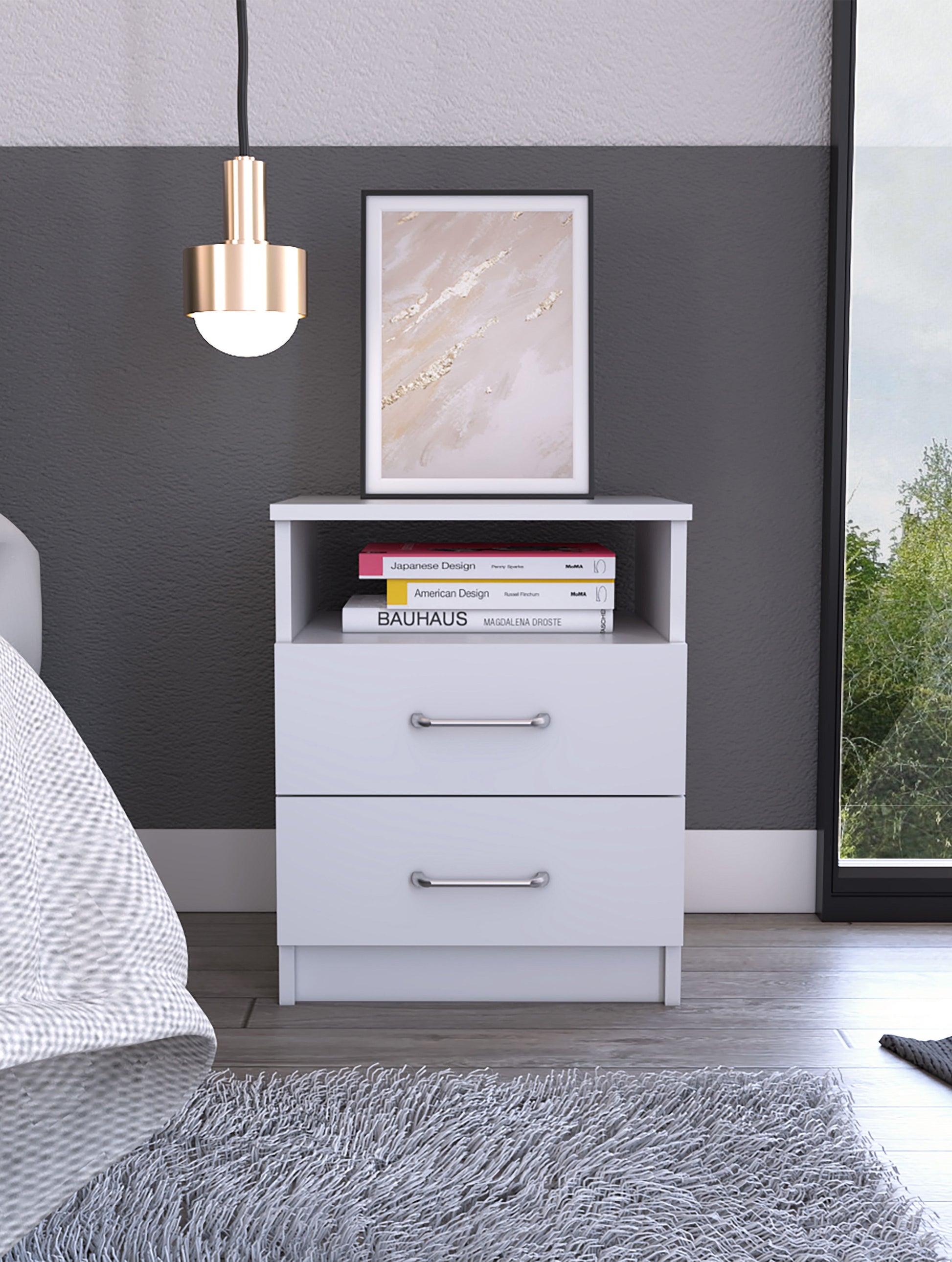 Brookeline 2-Drawer 1-Shelf White Nightstand by Doba with silver handles, framed art, and books