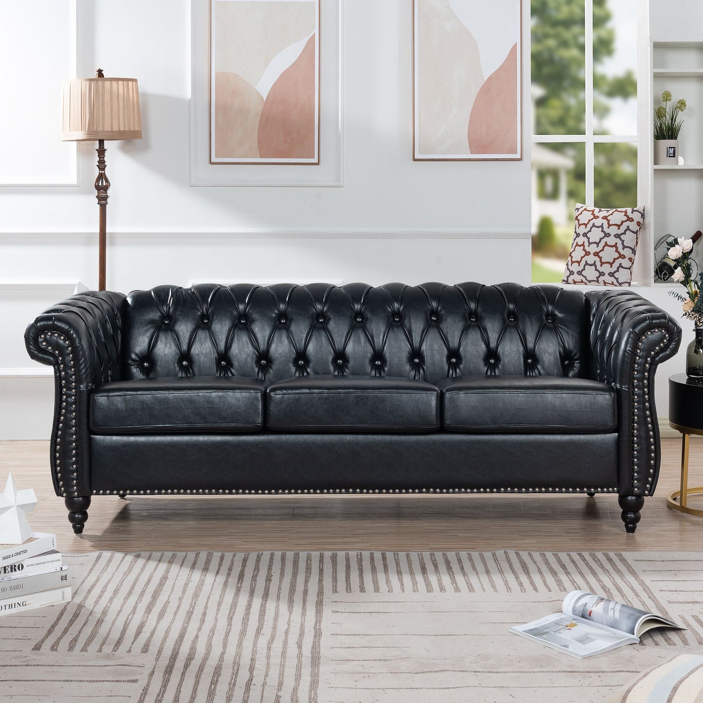 Chesterfield-style black PU leather three-seater sofa with rolled arms and tufted back