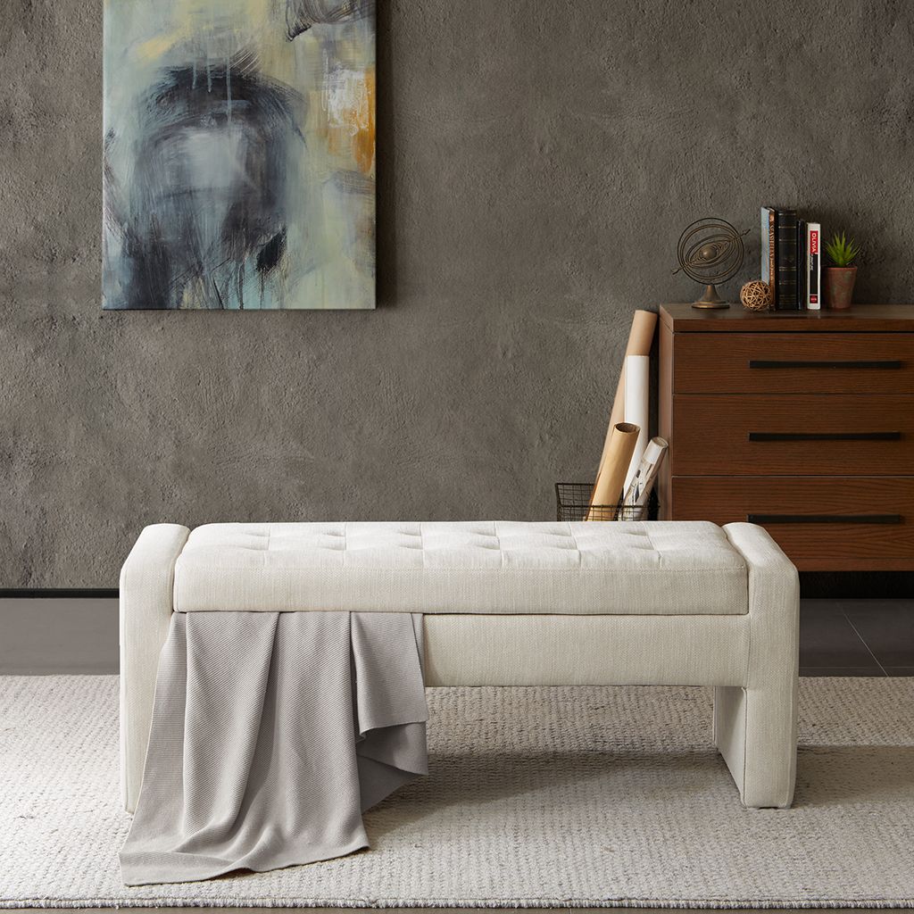 Soft Close Storage Bench in cream tufted fabric with a grey throw draped over the side