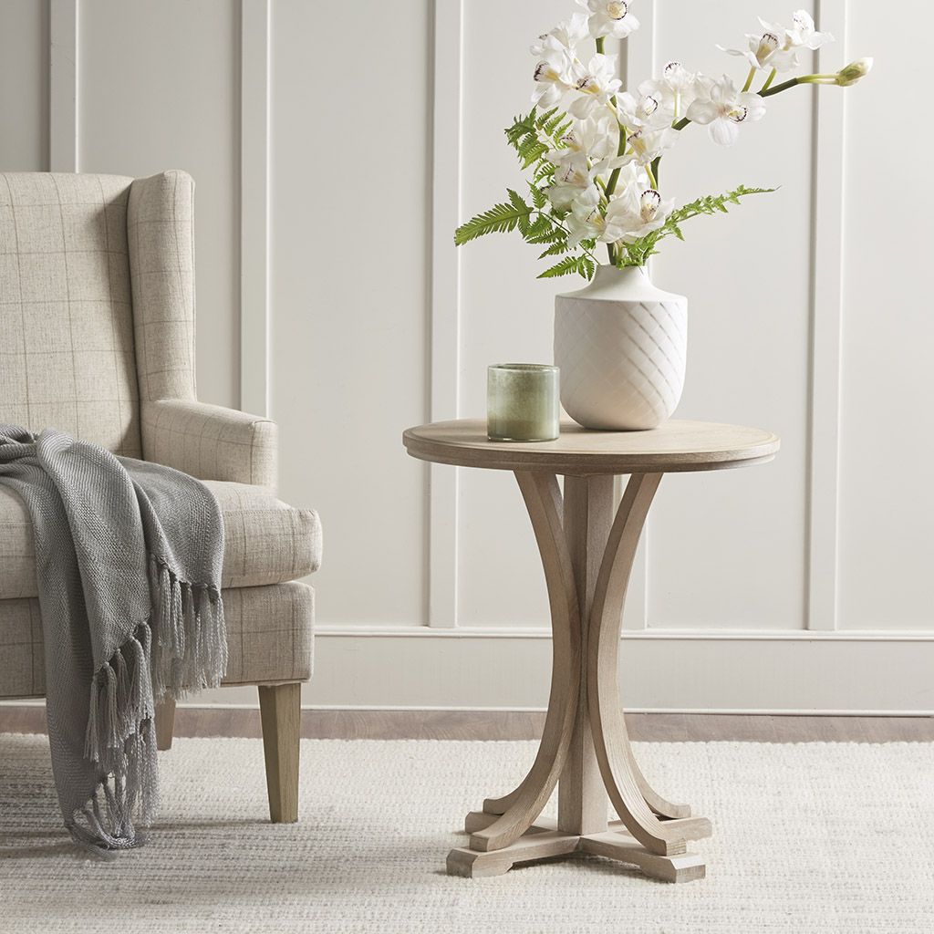 Fatima Accent Table by Doba; light natural wood round top with curved pedestal legs