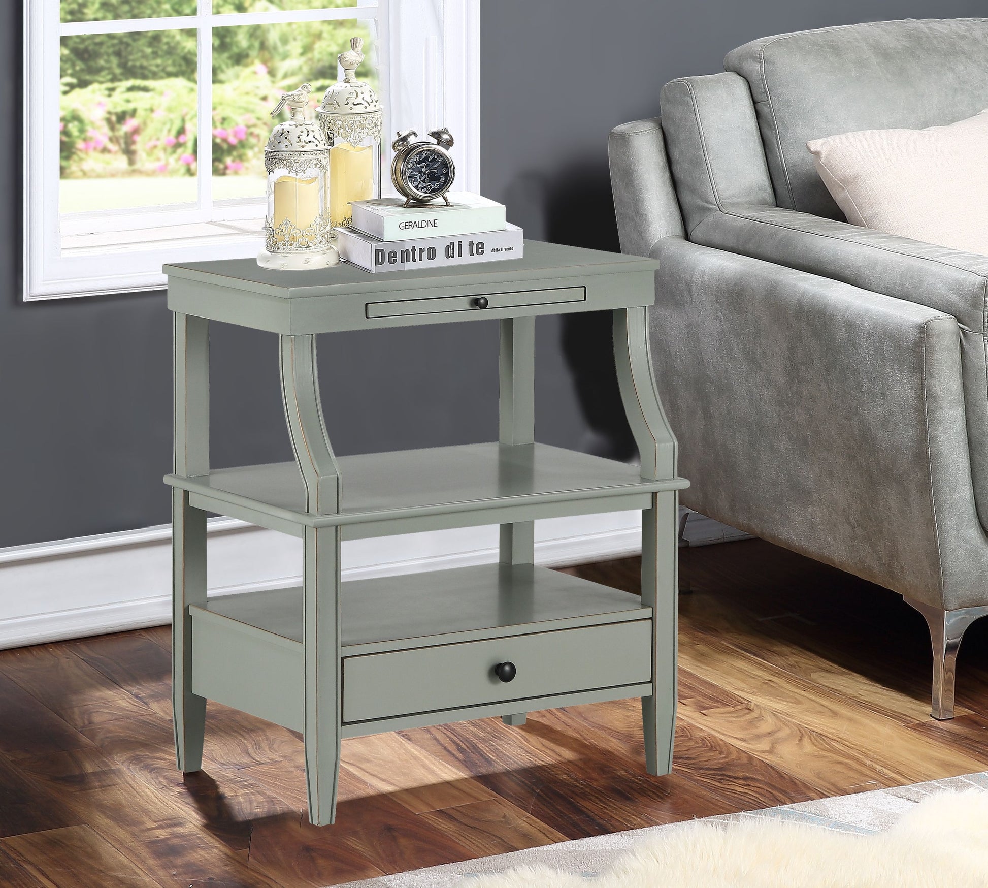 Newland antique grey storage nightstand with drawer and lower shelf, topped by two decorative lanterns and a clock