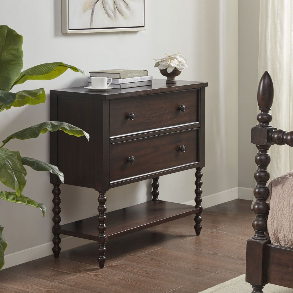 Two-drawer dark brown wood accent chest with turned legs and lower shelf