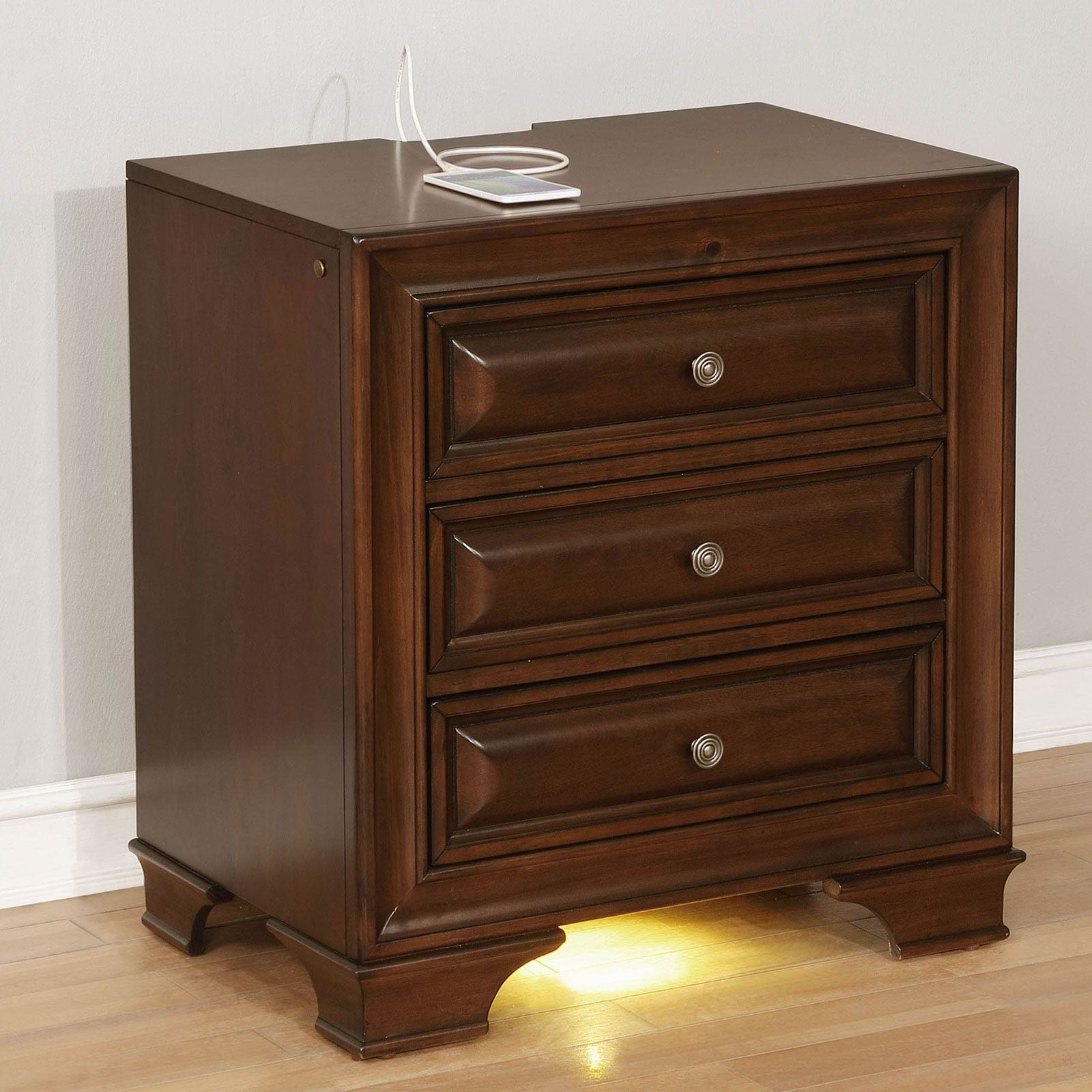 Nightstand: brown cherry solid wood, 3-drawer with nickel round knobs, transitional style, under nightlight.