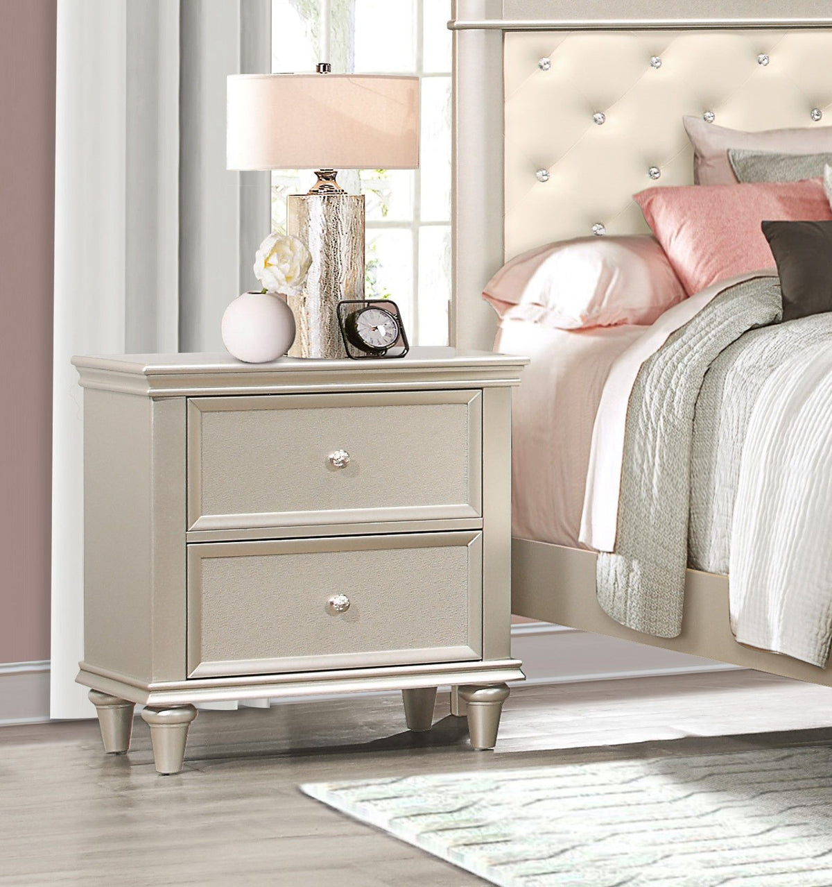 Three-drawer nightstand in a silver finish with textural fronts and crystal knobs