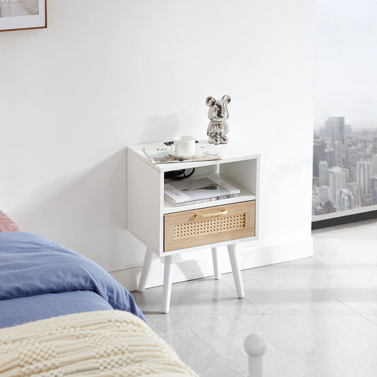 White end table with cane-front drawer and solid wood legs, topped by a metallic bear figurine.