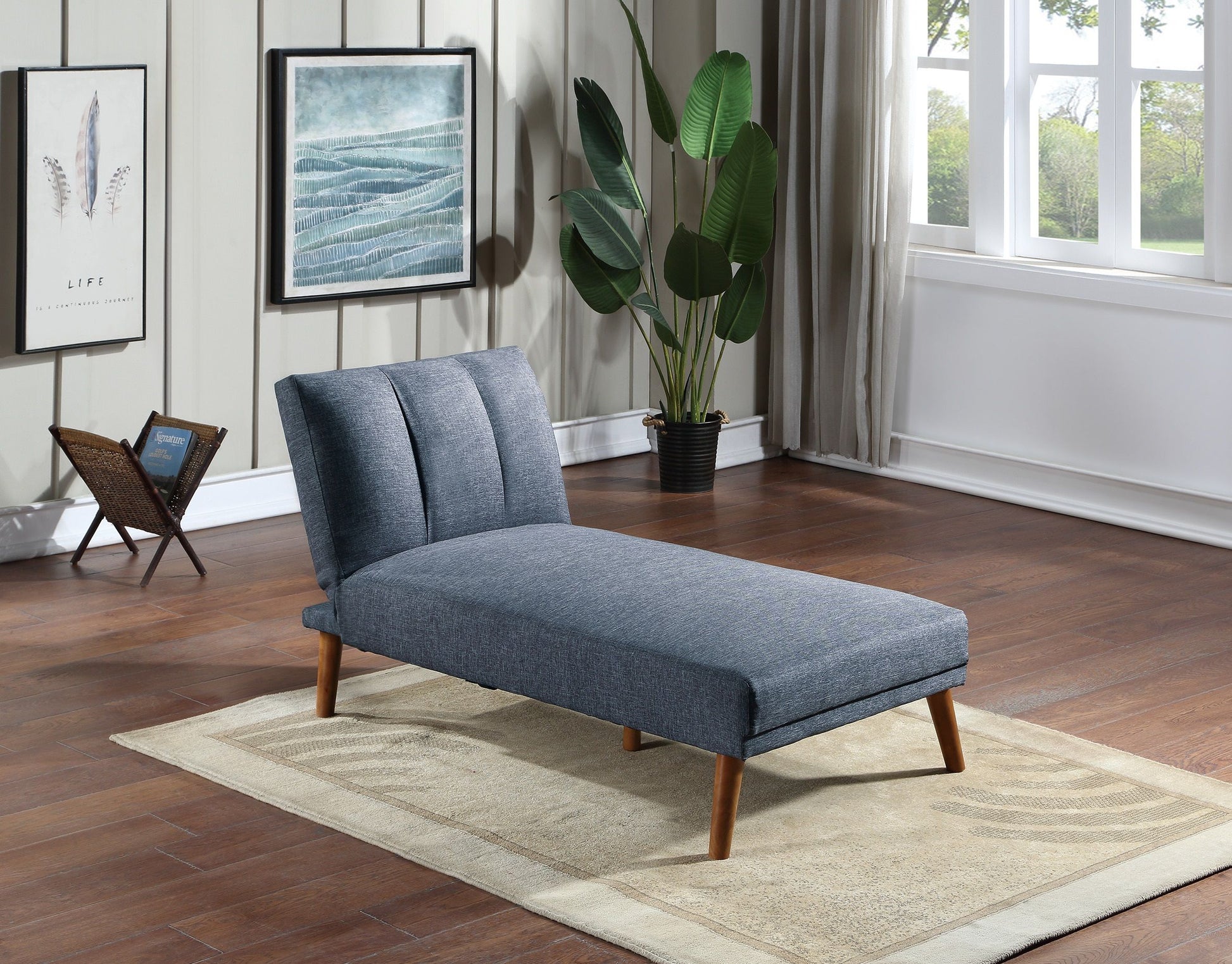 Chaise lounge in navy polyfiber with solid wood legs in a living room