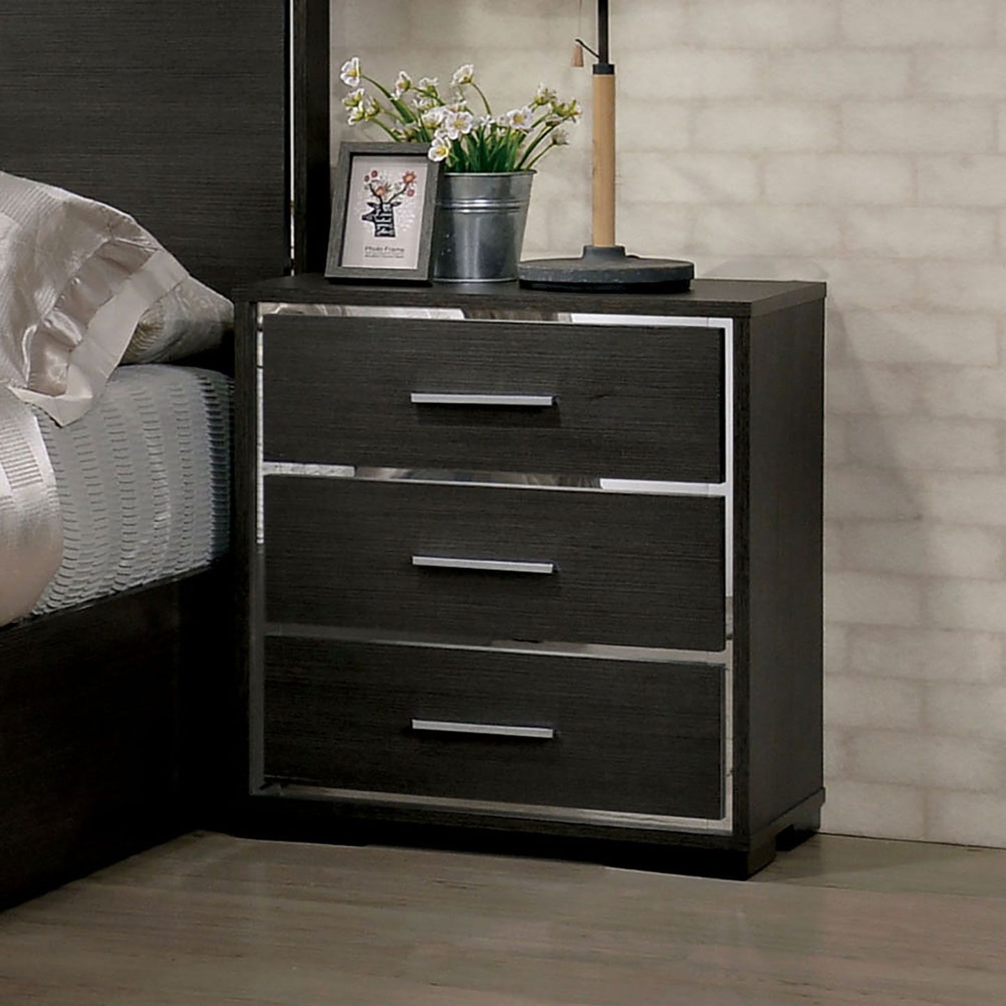 Nightstand in dark wood with chrome-trim framed three-drawer design for a modern contemporary bedroom