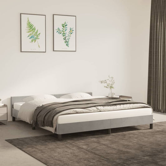 Bed frame with upholstered headboard in light grey velvet; engineered wood and plywood construction; Doba brand.