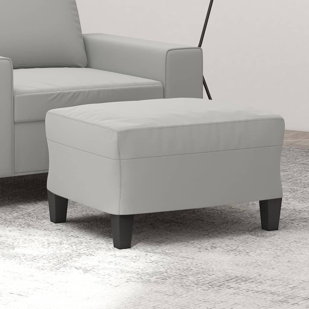 Footstool in light gray microfiber fabric; compact, durable with dark wood legs