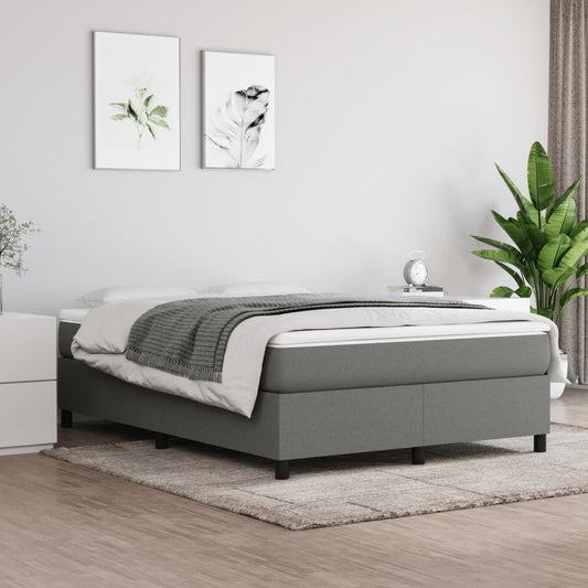 Full bed frame in dark grey polyester with modern design; shown with a nightstand and plant in a neutral bedroom.