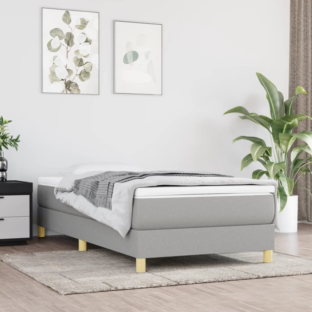 Bed Frame Twin XL in light gray polyester upholstery with pale wood legs