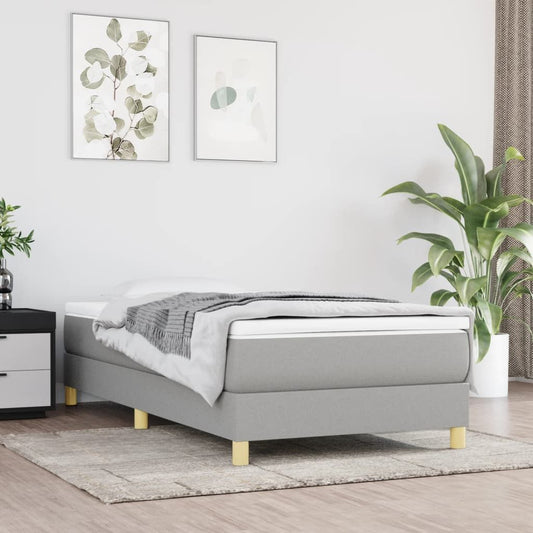 Bed Frame Twin XL in light gray polyester upholstery with pale wood legs