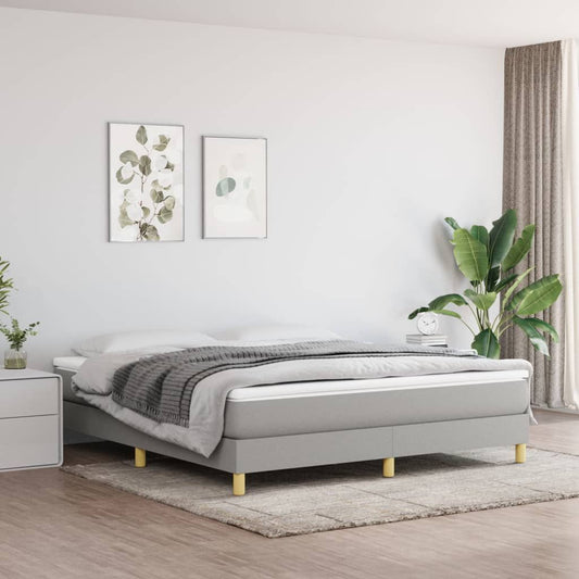 King bed frame with light grey polyester upholstery and plywood/engineered wood construction.