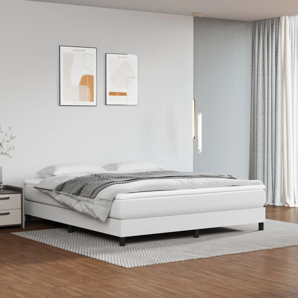 King size white faux leather bed frame with low profile platform in modern bedroom setup