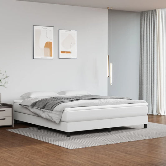 King size white faux leather bed frame with low profile platform in modern bedroom setup