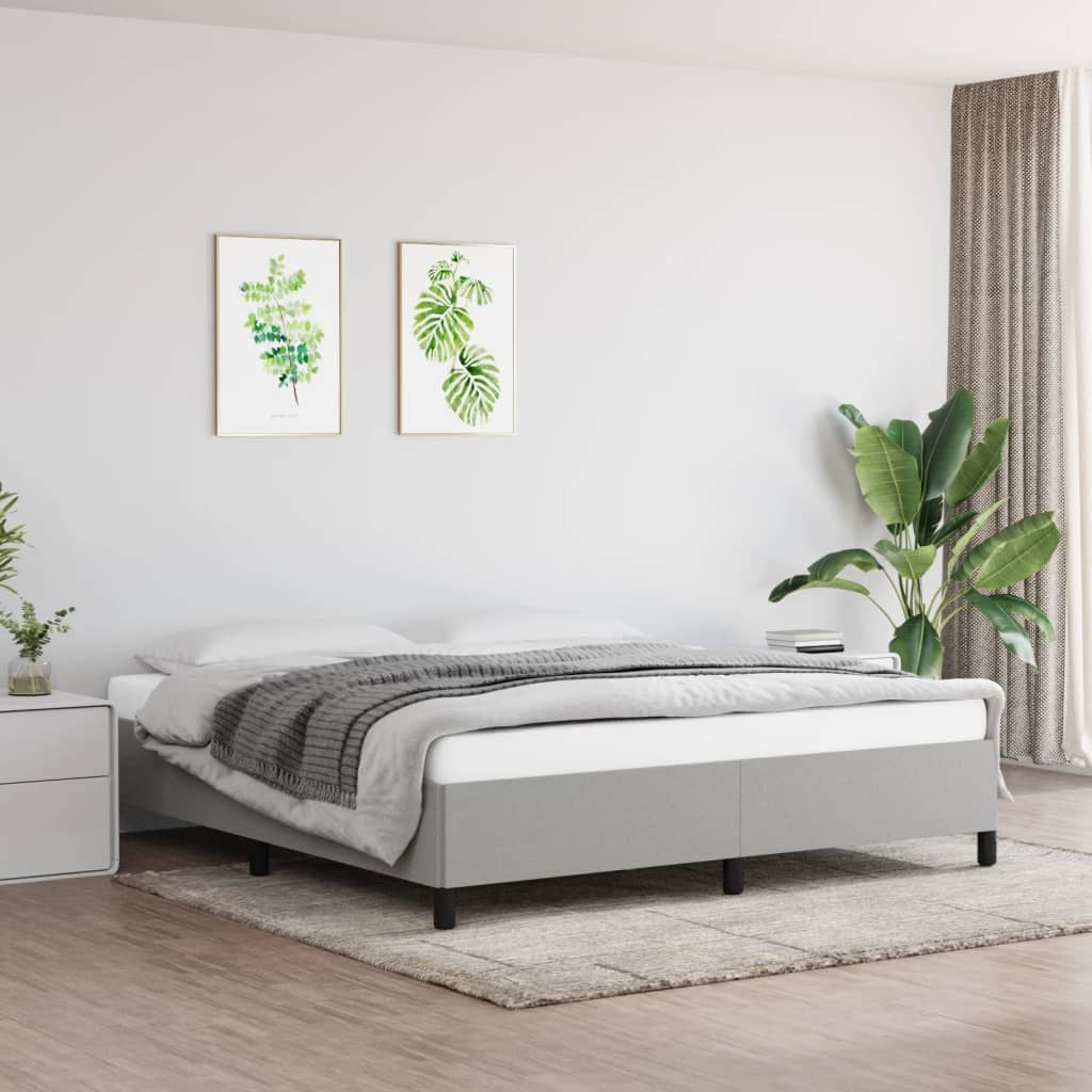 King-size bed frame in light gray polyester fabric with a low-profile platform and black legs.