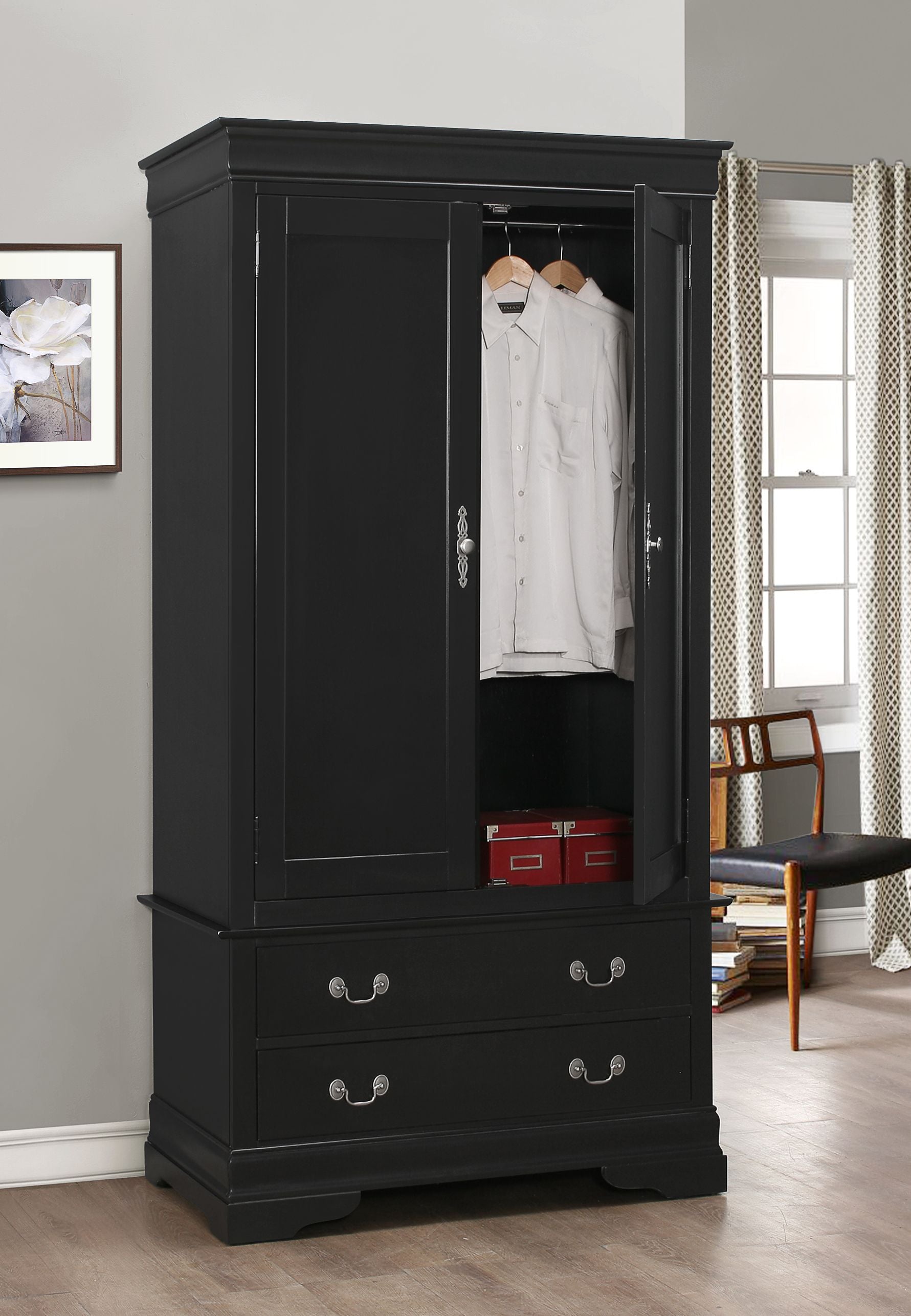 Elegant black traditional armoire with open doors, hanging shirts inside, and two red storage boxes