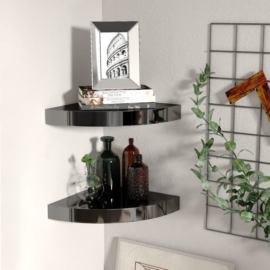 Corner shelf set of 2; floating high-gloss black honeycomb MDF shelves with books and bottles.