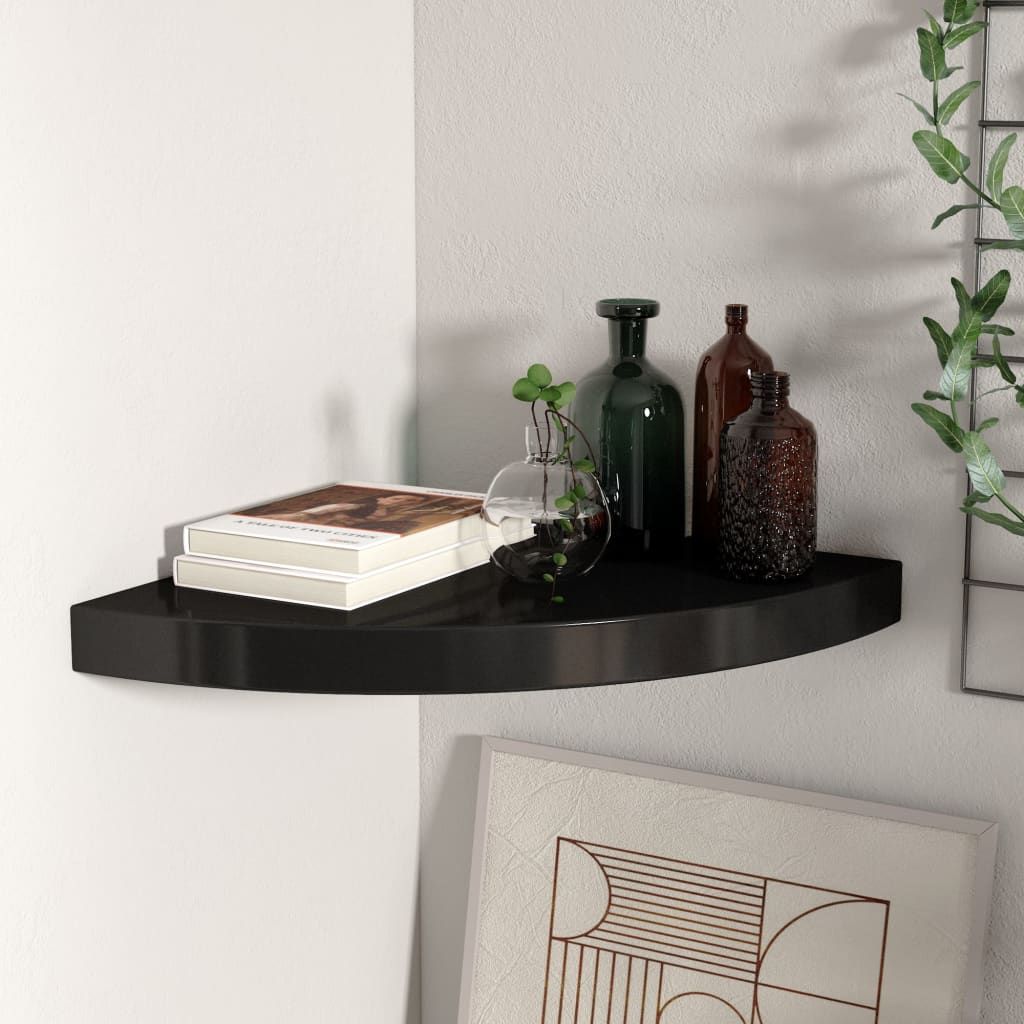 Floating black honeycomb MDF corner shelf, metal; holds 2 books and 3 decorative bottles.