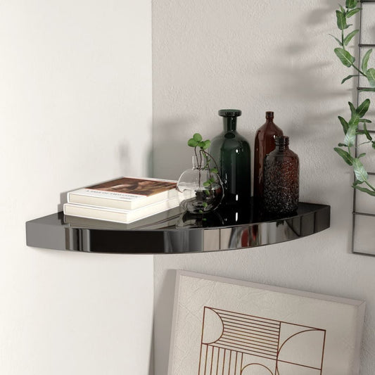 Corner shelf floating curved high-gloss black MDF; holds 2 books, 3 bottles, and a glass vase.