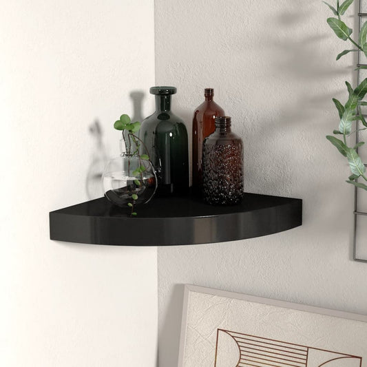 Corner wall shelf in glossy black MDF with metal mount; curved edge with glass vase and bottles