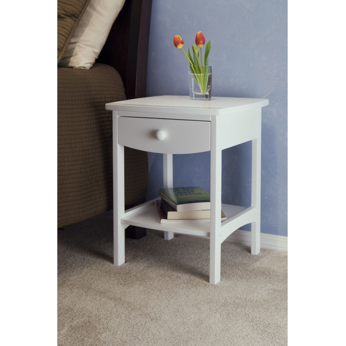 Claire Accent Table with white finish, single drawer and lower shelf, tulip vase on top.