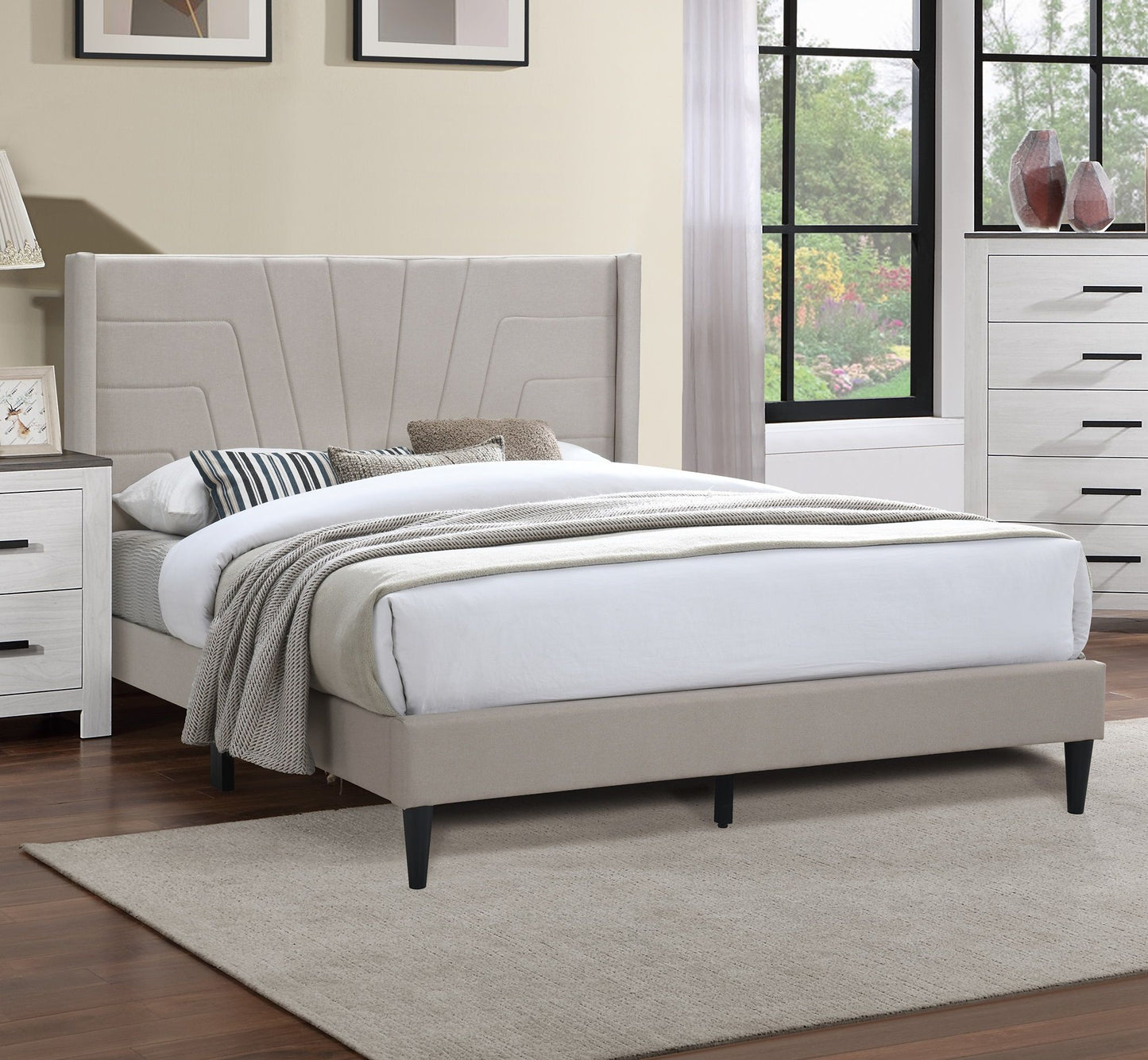 Queen size bed with light brown burlap upholstered headboard and platform frame