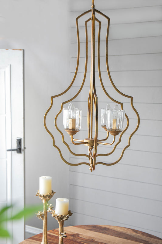 4-light gold metal chandelier with curved open frame and glass candle-style bulbs on an adjustable hanging chain
