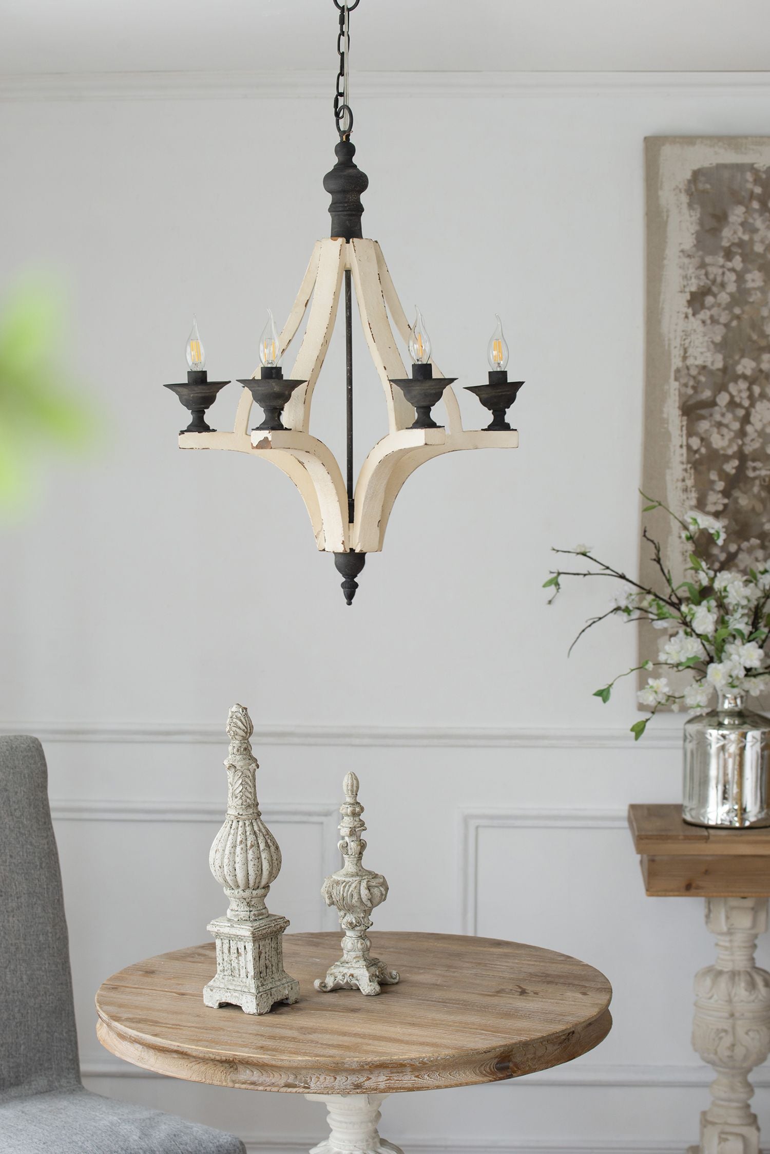 6-light chandelier with distressed light wood arms and black metal accents on a hanging chain