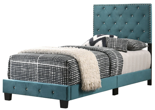 Charming twin bed with teal tufted headboard, crystal stud accents, and geometric black-and-white bedding