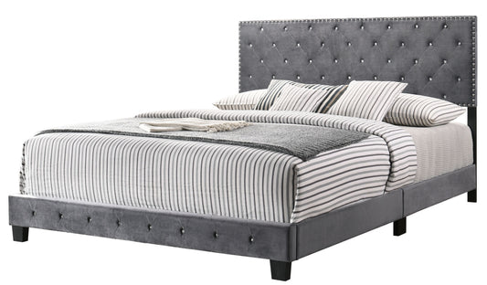 Transitional gray king bed with tufted upholstered headboard and nailhead trim, striped bedding