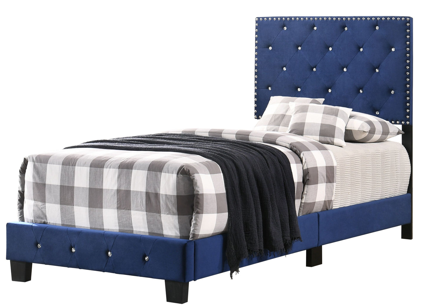 Twin bed in navy blue upholstery with tufted headboard and crystal-studded trim; gray plaid bedding.