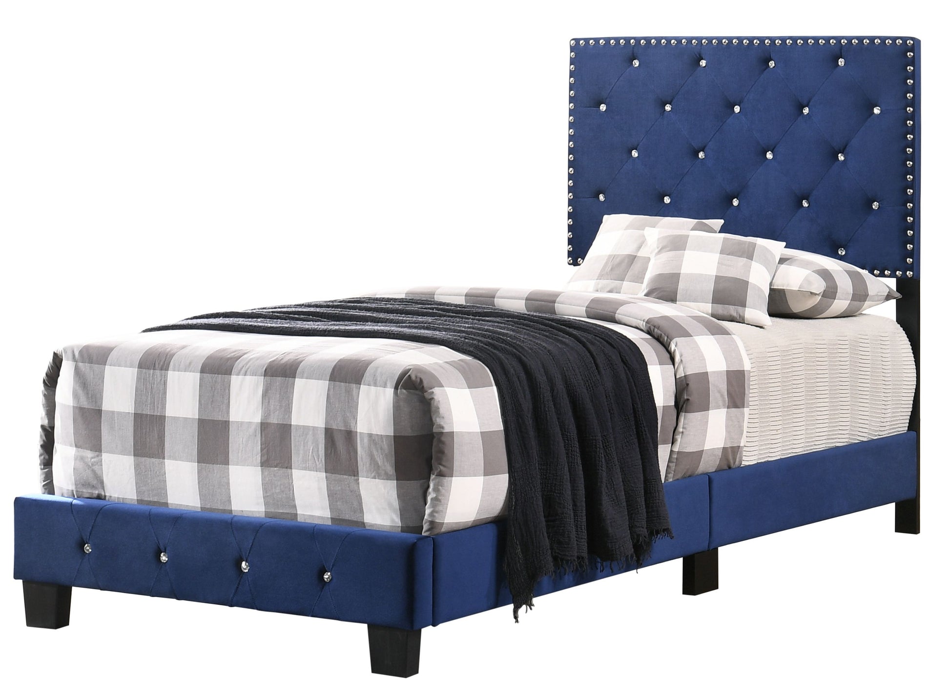 Twin bed in navy blue upholstery with tufted headboard and crystal-studded trim; gray plaid bedding.