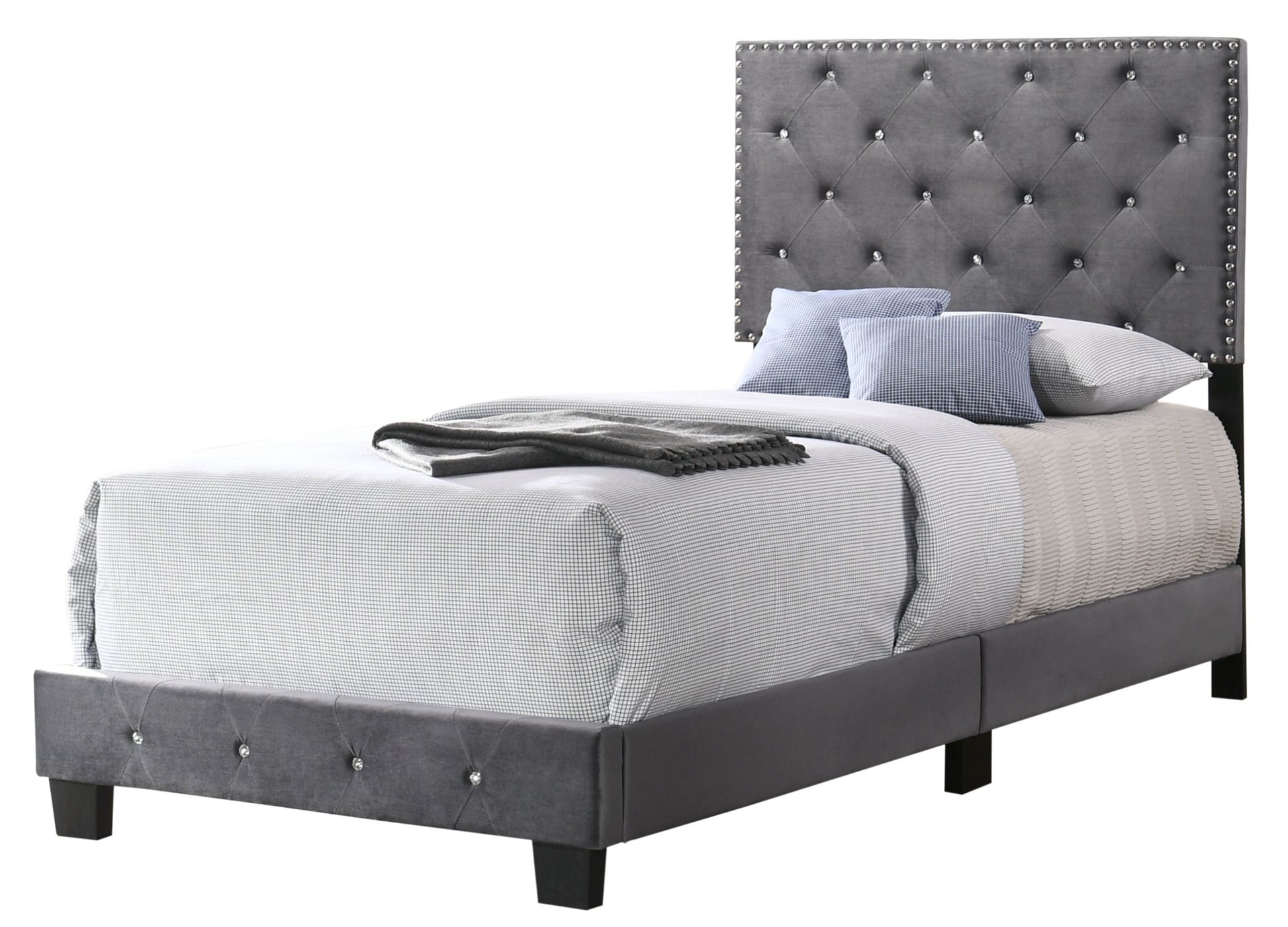 Twin bed with gray tufted upholstered headboard featuring diamond tufting and nailhead trim