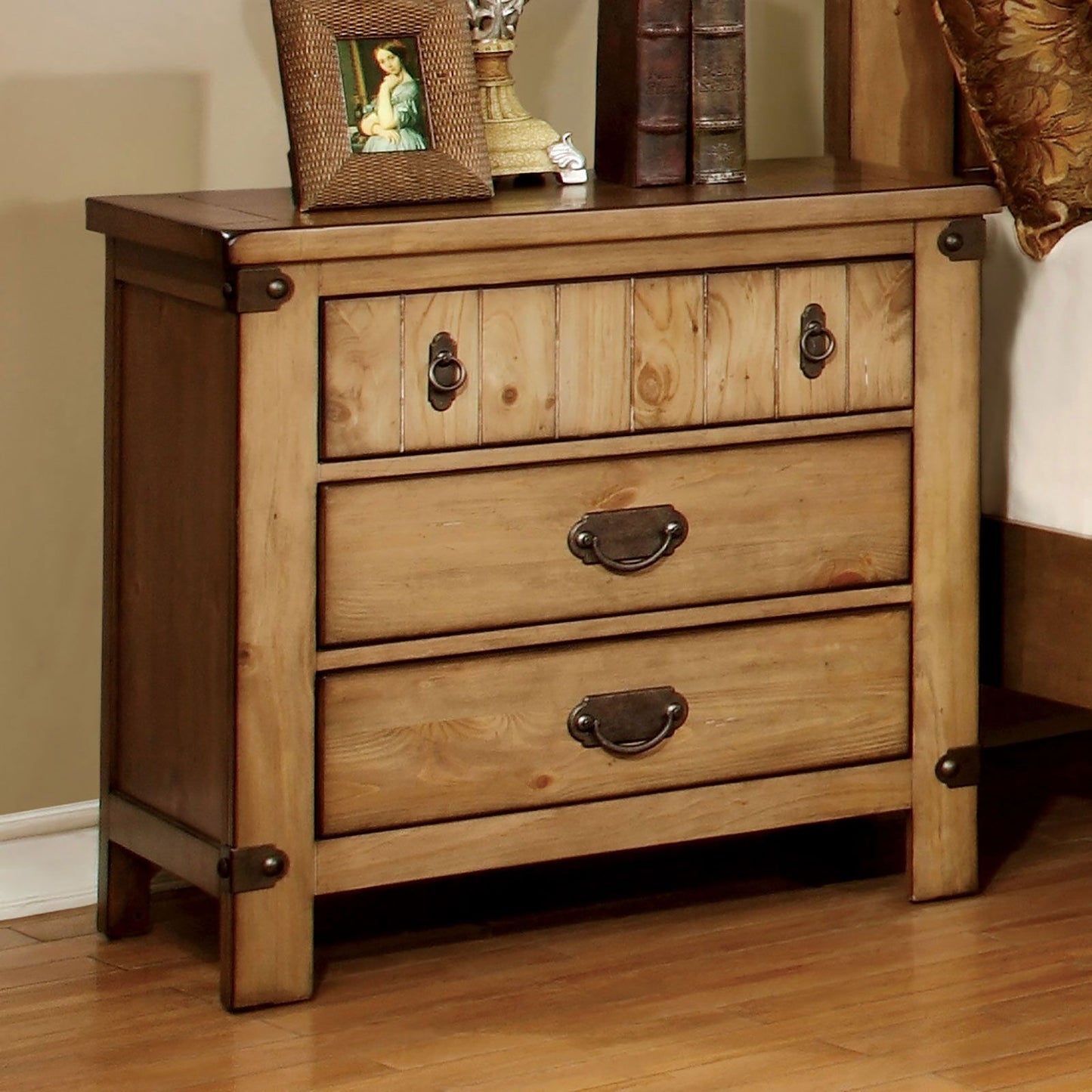 Cottage-style weathered elm nightstand with 4 drawers and metal ring pulls